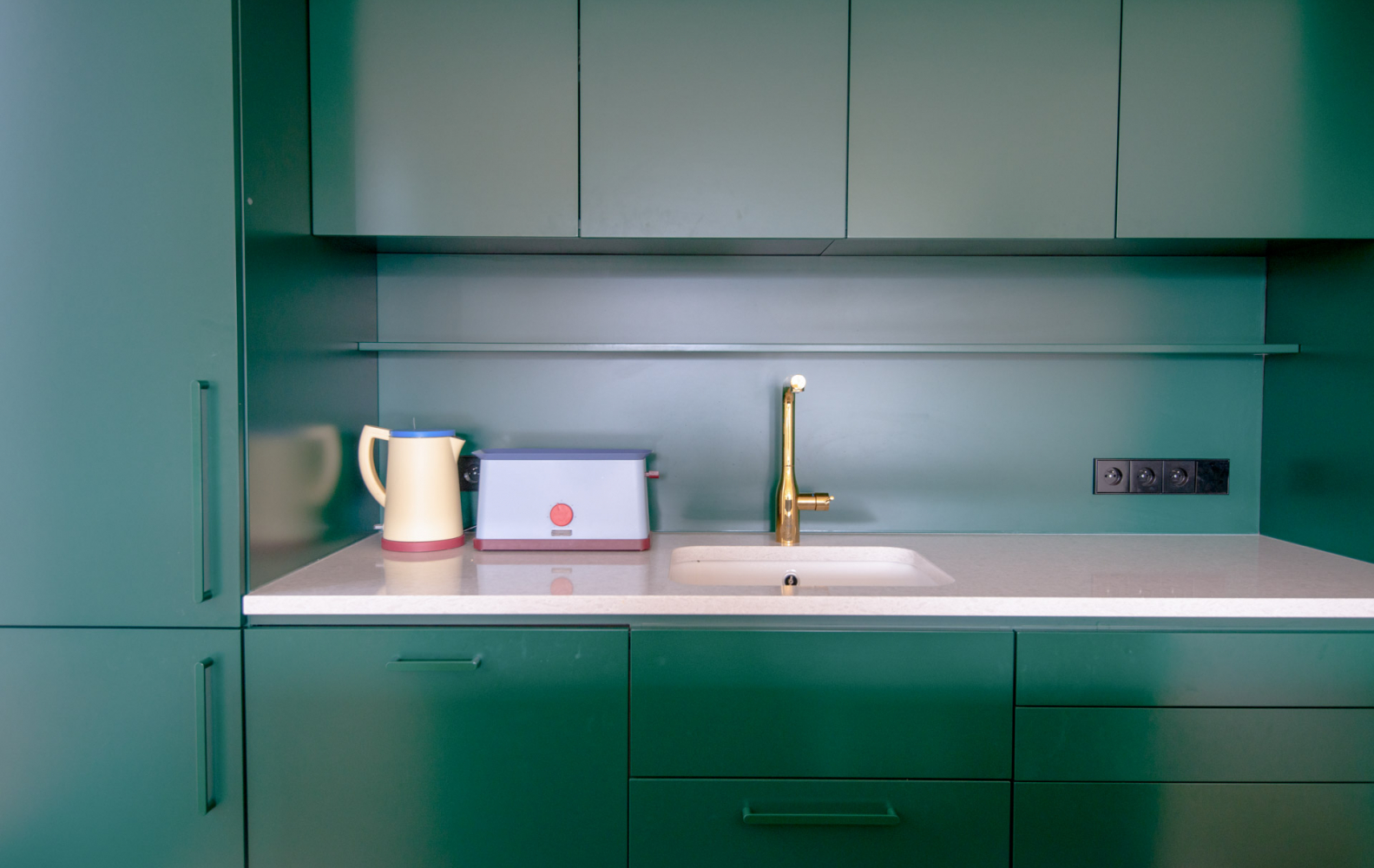 A Townhouse with Petrol-Green Accents